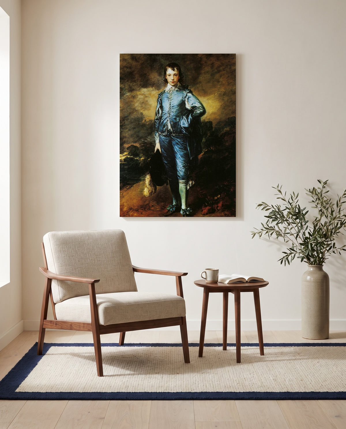The Blue Boy by Thomas Gainsborough as a stretched canvas above a linen lounge chair in a reading corner