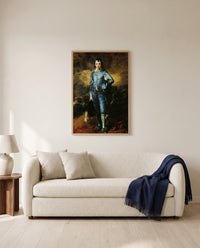 The Blue Boy by Thomas Gainsborough framed in natural oak above a cream sofa in a warm living room