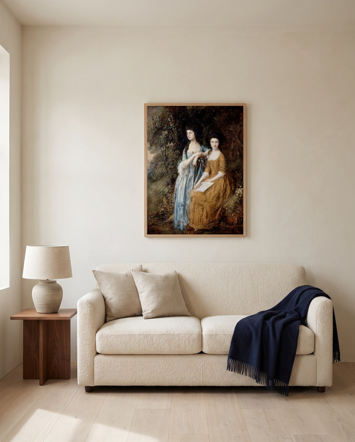 The Linley Sisters by Thomas Gainsborough framed in natural oak above a cream sofa in a warm living room