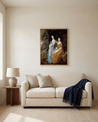 The Linley Sisters by Thomas Gainsborough framed in natural oak above a cream sofa in a warm living room