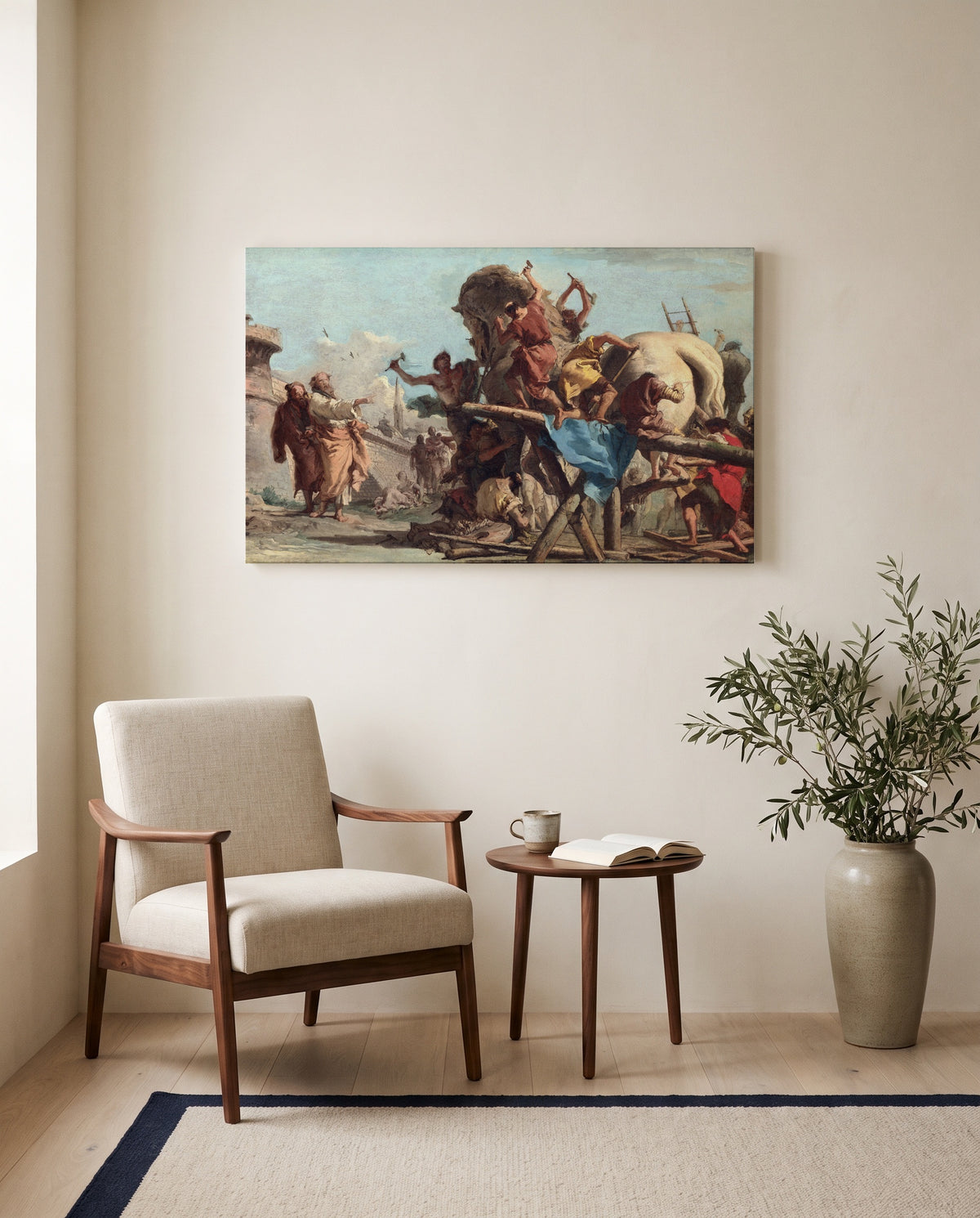 The Building of the Trojan Horse by Giandomenico Tiepolo as a stretched canvas above a linen lounge chair in a reading corner