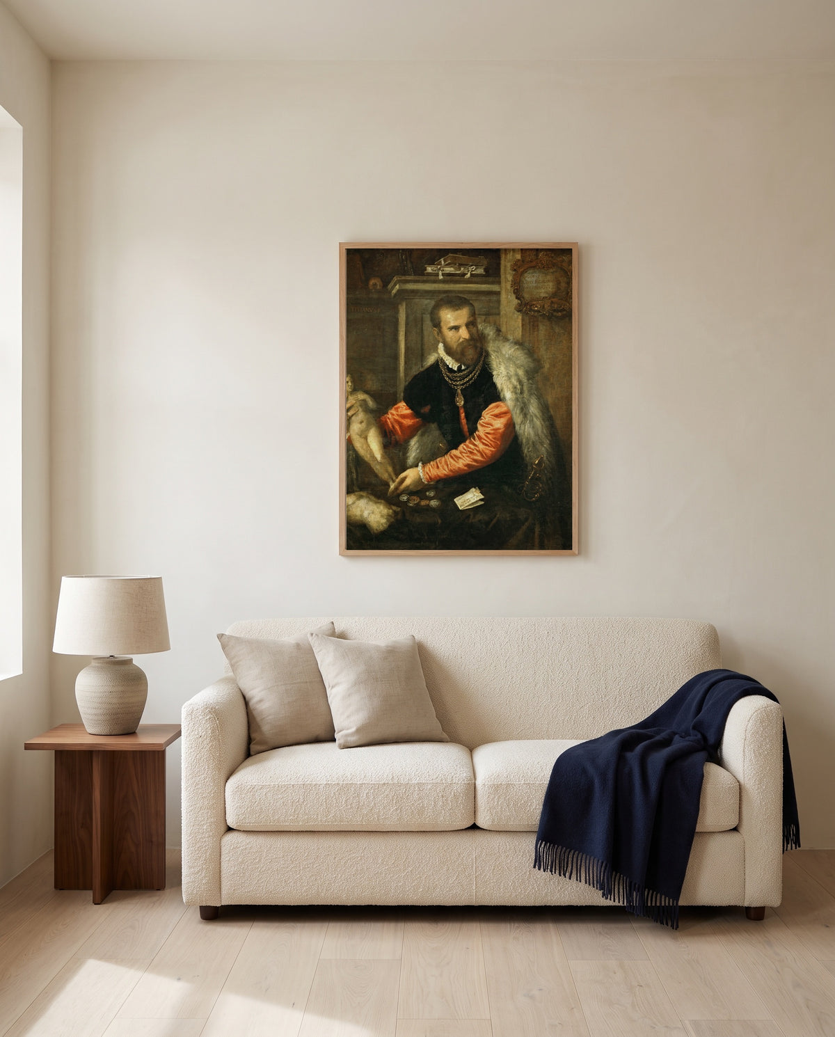 Jacopo Strada by Titian framed in natural oak above a cream sofa in a warm living room