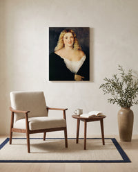 Woman in a Black Dress by Titian as a stretched canvas above a linen lounge chair in a reading corner