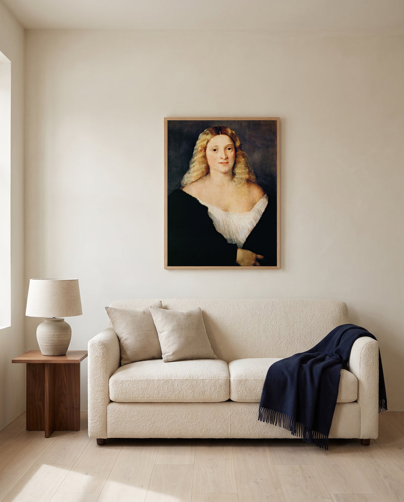 Woman in a Black Dress by Titian framed in natural oak above a cream sofa in a warm living room