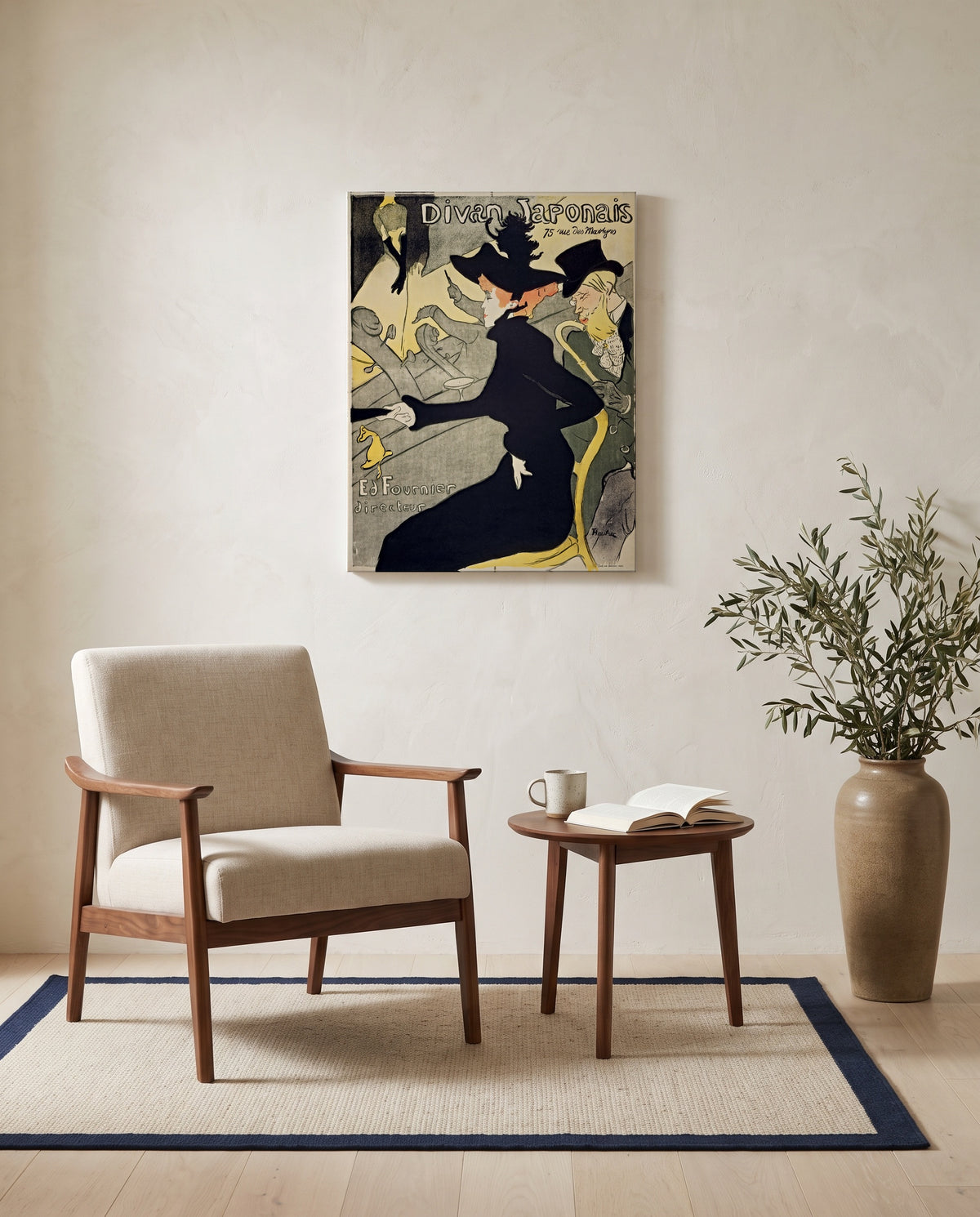 Divan Japonais by Henri de Toulouse-Lautrec as a stretched canvas above a linen lounge chair in a reading corner