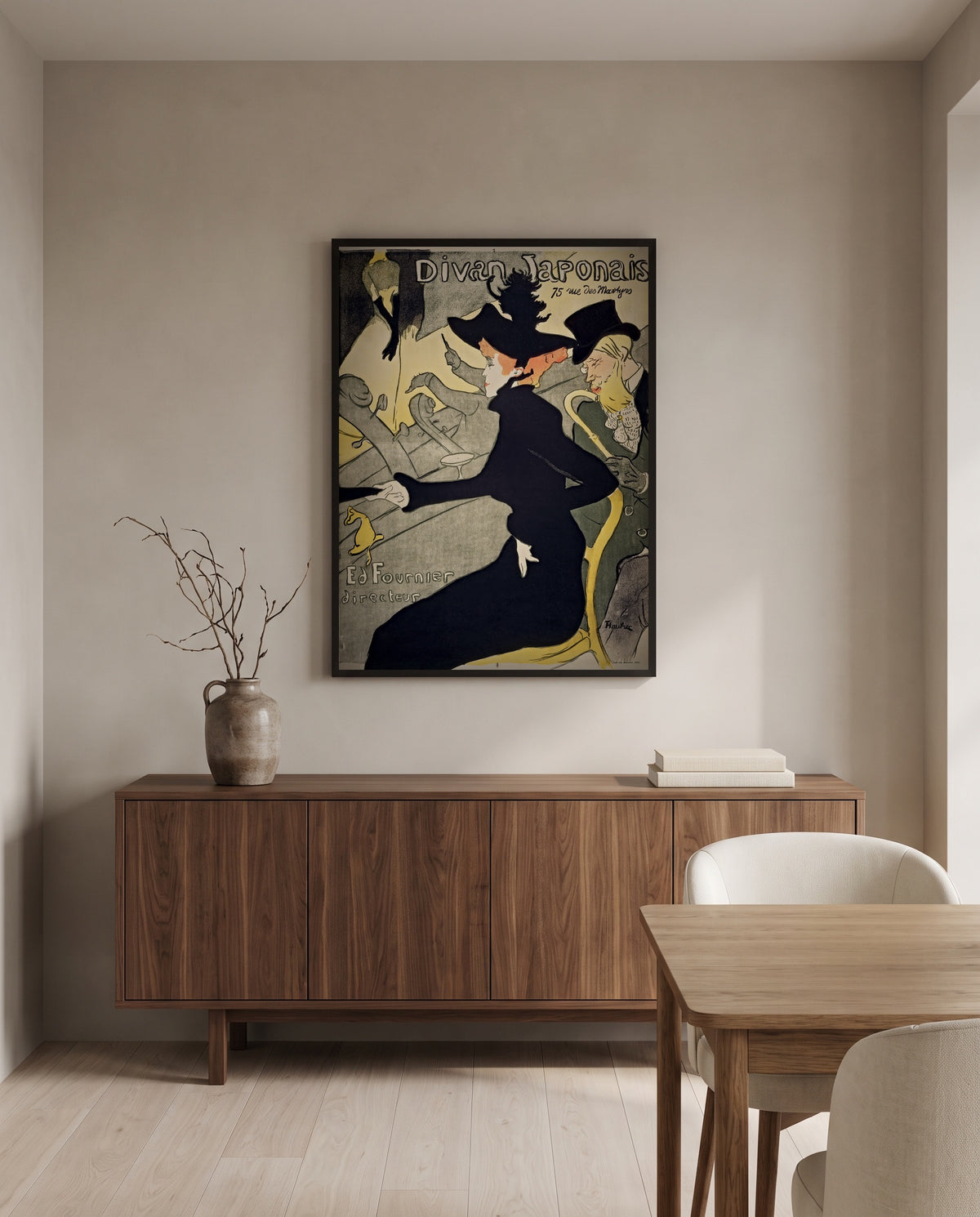 Divan Japonais by Henri de Toulouse-Lautrec in a black frame above a walnut sideboard in a dining room