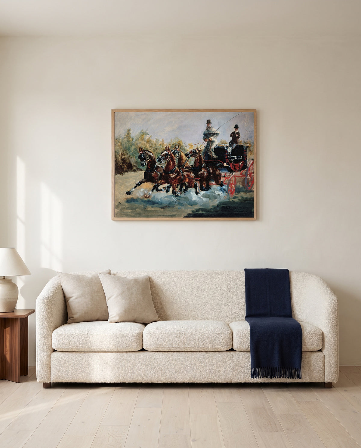 The Mail-Coach by Henri de Toulouse-Lautrec framed in natural oak above a cream sofa in a warm living room