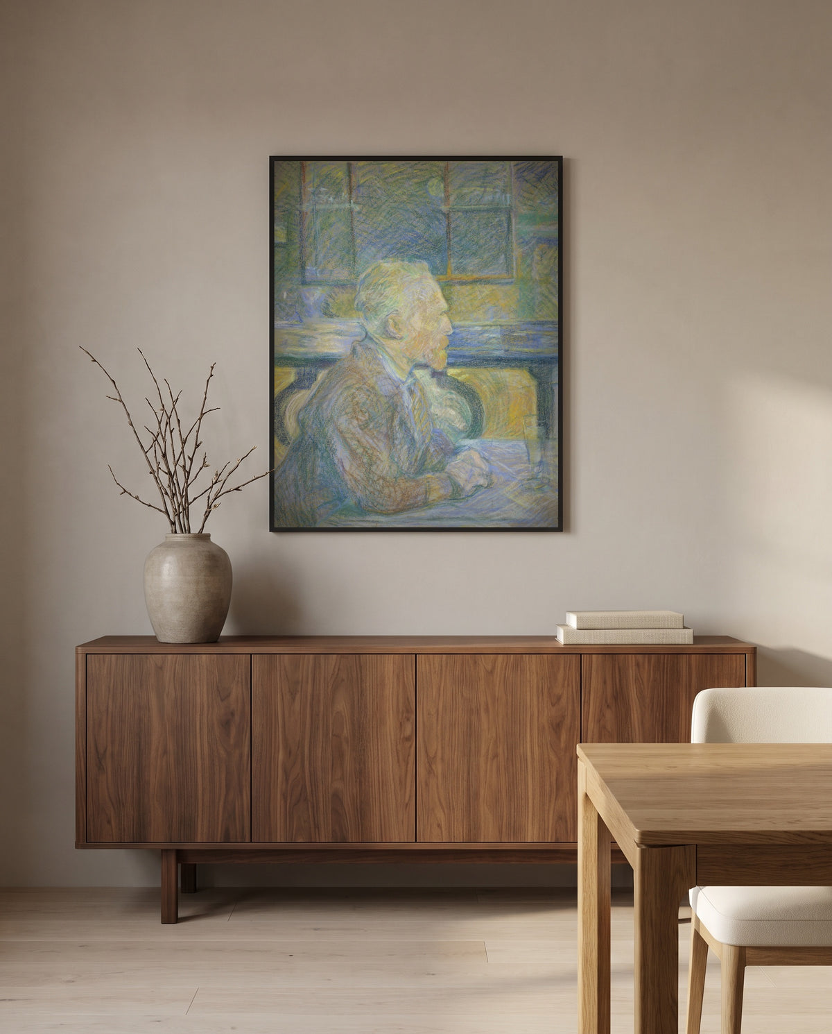 Portrait of Van Gogh by Henri de Toulouse-Lautrec in a black frame above a walnut sideboard in a dining room