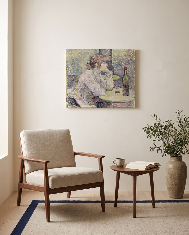 The Hangover by Henri de Toulouse-Lautrec as a stretched canvas above a linen lounge chair in a reading corner