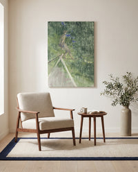 The Tightrope Dancer by Henri de Toulouse-Lautrec as a stretched canvas above a linen lounge chair in a reading corner