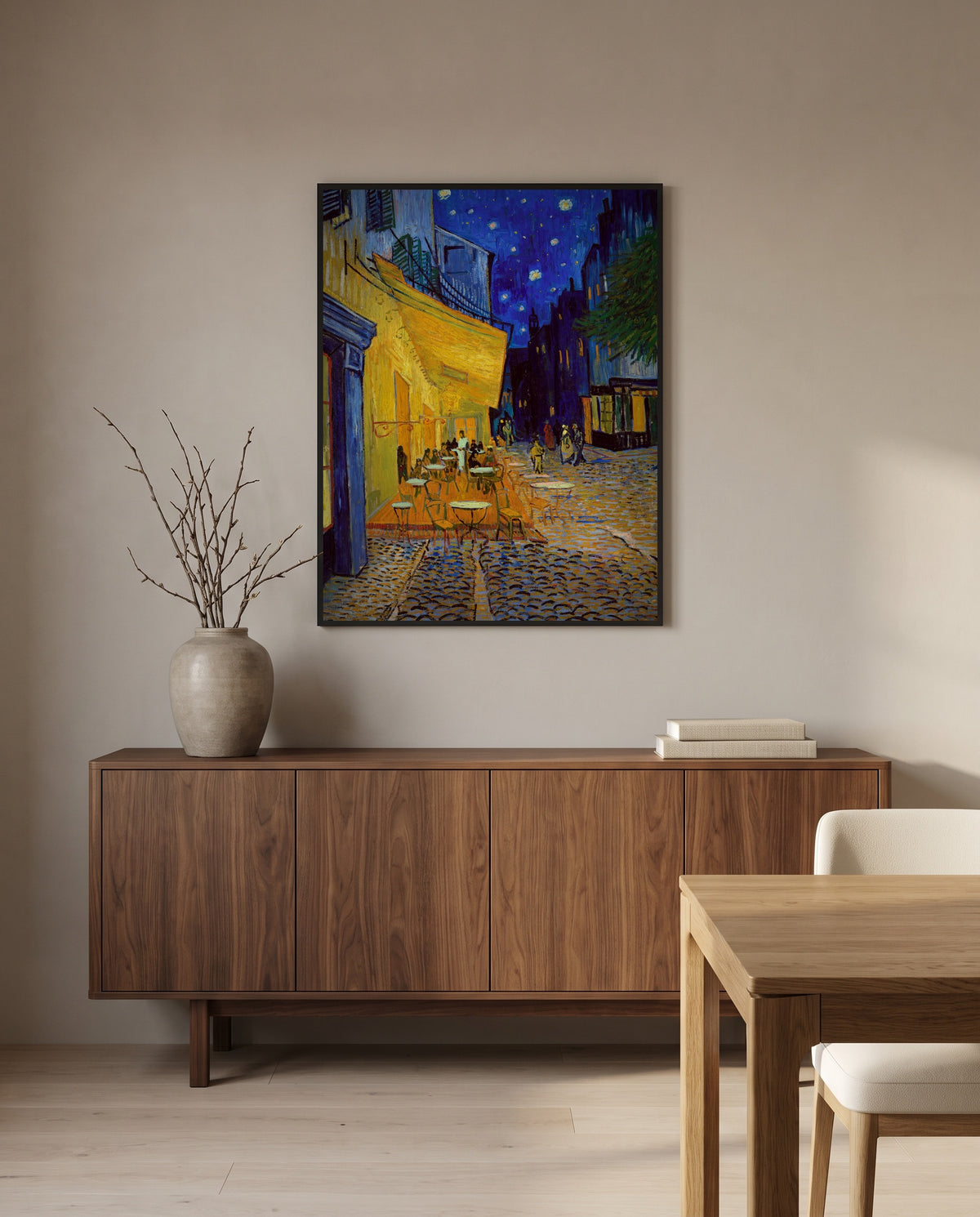 Café Terrace at Night by Vincent van Gogh in a black frame above a walnut sideboard in a dining room
