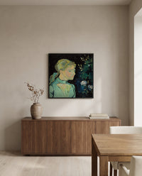 Adeline Ravoux by Vincent van Gogh in a black frame above a walnut sideboard in a dining room