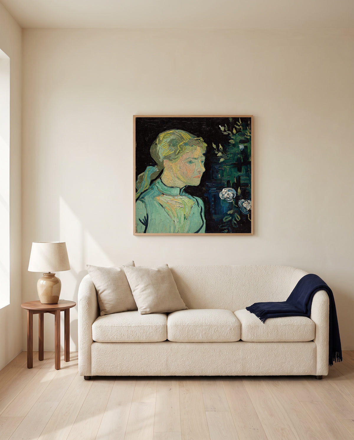 Adeline Ravoux by Vincent van Gogh framed in natural oak above a cream sofa in a warm living room