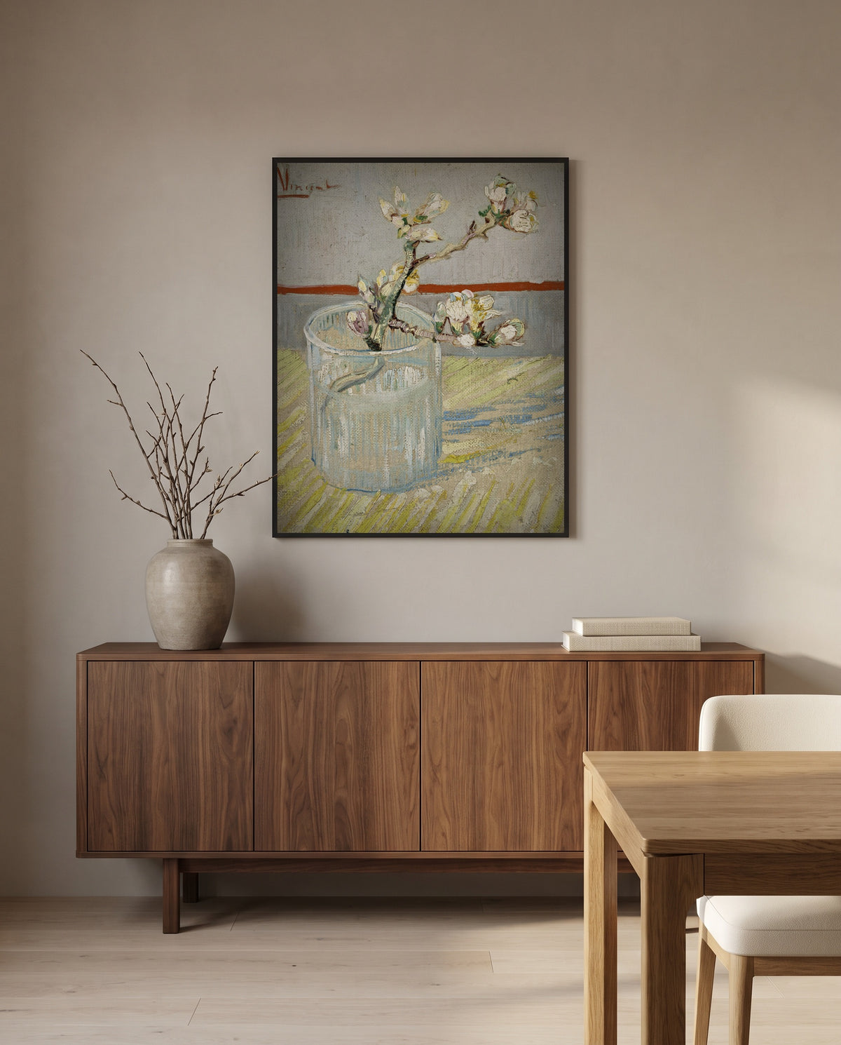 Almond Branch in a Glass by Vincent van Gogh in a black frame above a walnut sideboard in a dining room