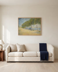 Along the Seine by Vincent van Gogh framed in natural oak above a cream sofa in a warm living room