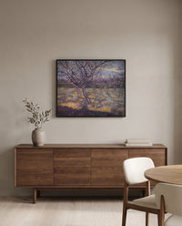 Apricot Trees in Blossom by Vincent van Gogh in a black frame above a walnut sideboard in a dining room