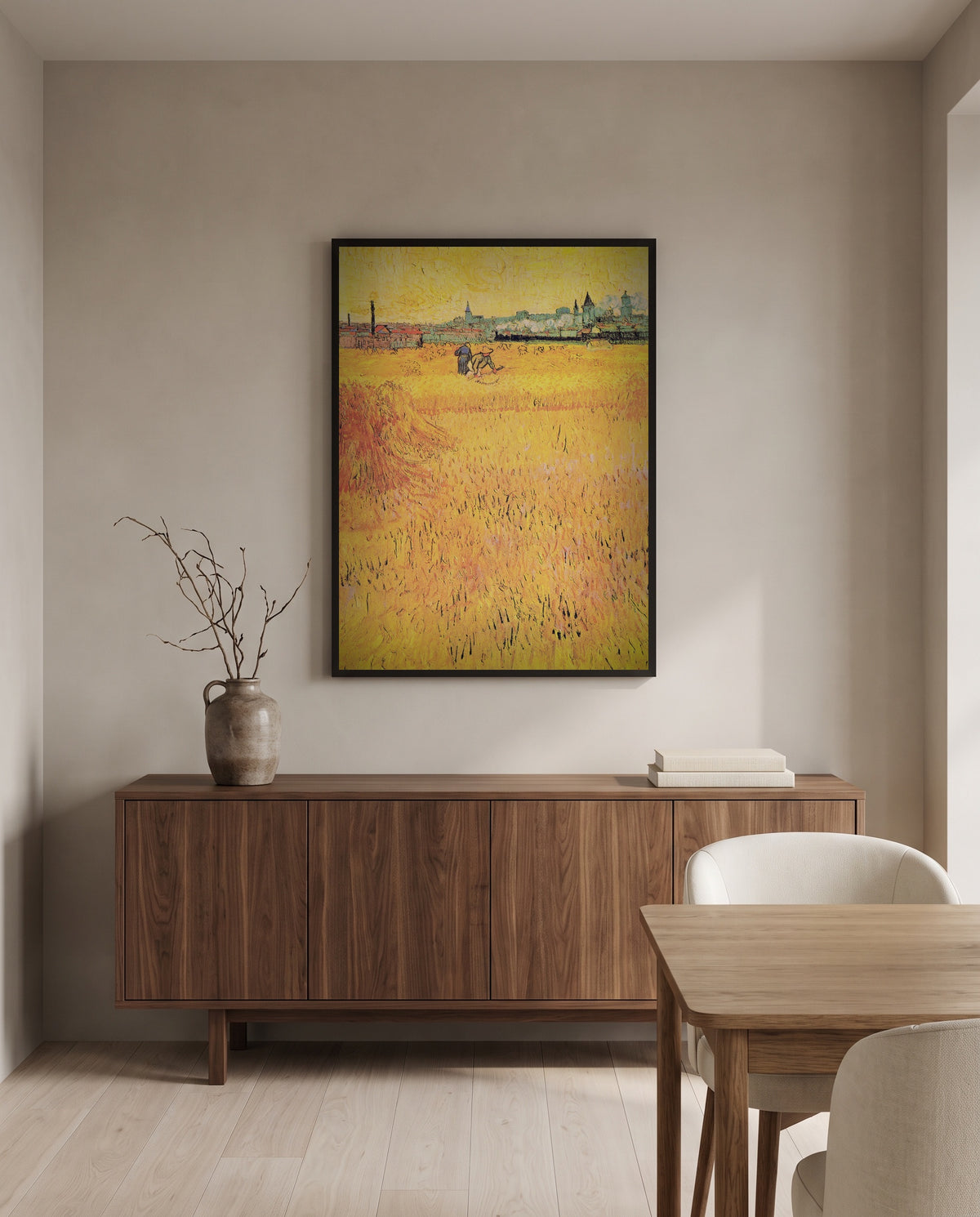Arles: View from the Wheat Fields by Vincent van Gogh in a black frame above a walnut sideboard in a dining room