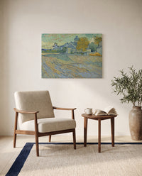 Asylum and Chapel of Saint-Rémy by Vincent van Gogh as a stretched canvas above a linen lounge chair in a reading corner