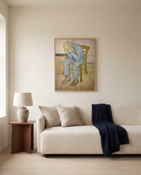 At Eternity’s Gate by Vincent van Gogh framed in natural oak above a cream sofa in a warm living room