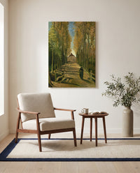 Avenue of Poplars in Autumn by Vincent van Gogh as a stretched canvas above a linen lounge chair in a reading corner