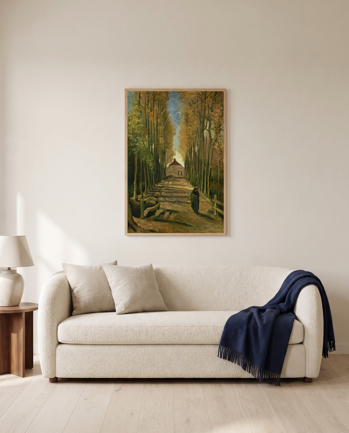 Avenue of Poplars in Autumn by Vincent van Gogh framed in natural oak above a cream sofa in a warm living room