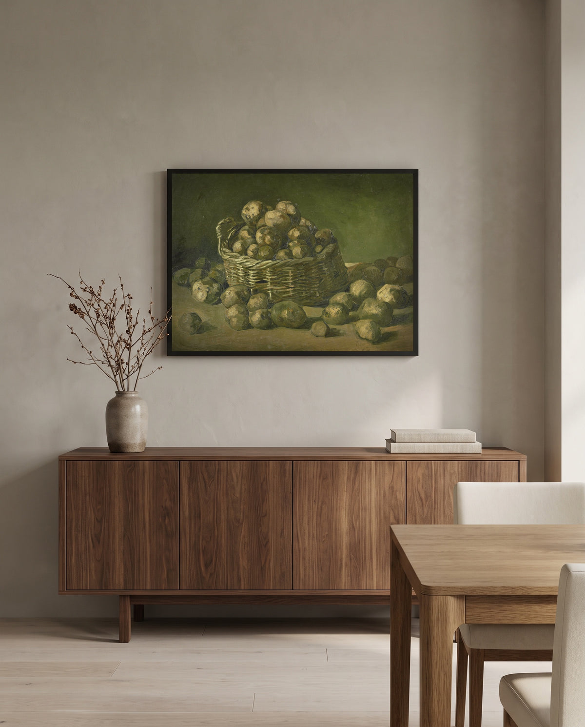 Basket of Potatoes by Vincent van Gogh in a black frame above a walnut sideboard in a dining room