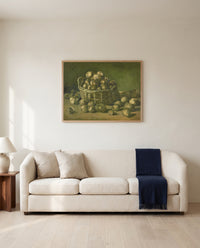 Basket of Potatoes by Vincent van Gogh framed in natural oak above a cream sofa in a warm living room