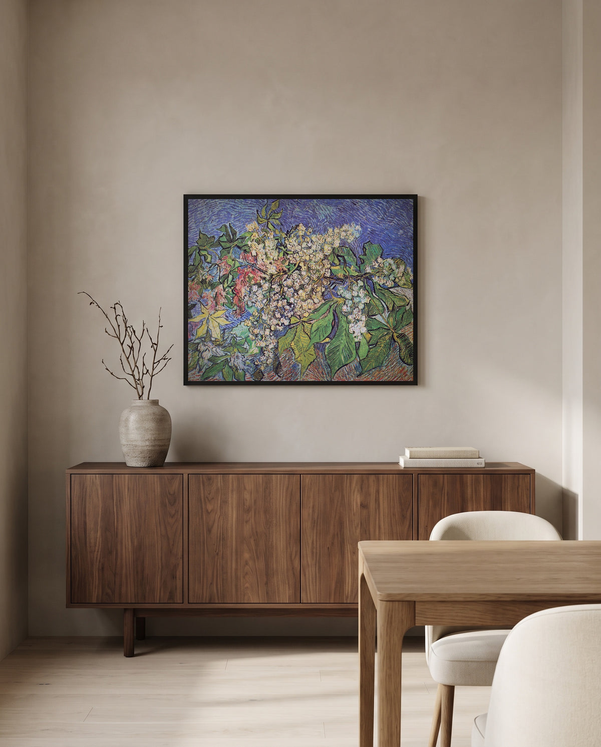 Blossoming Chestnut Branches by Vincent van Gogh in a black frame above a walnut sideboard in a dining room