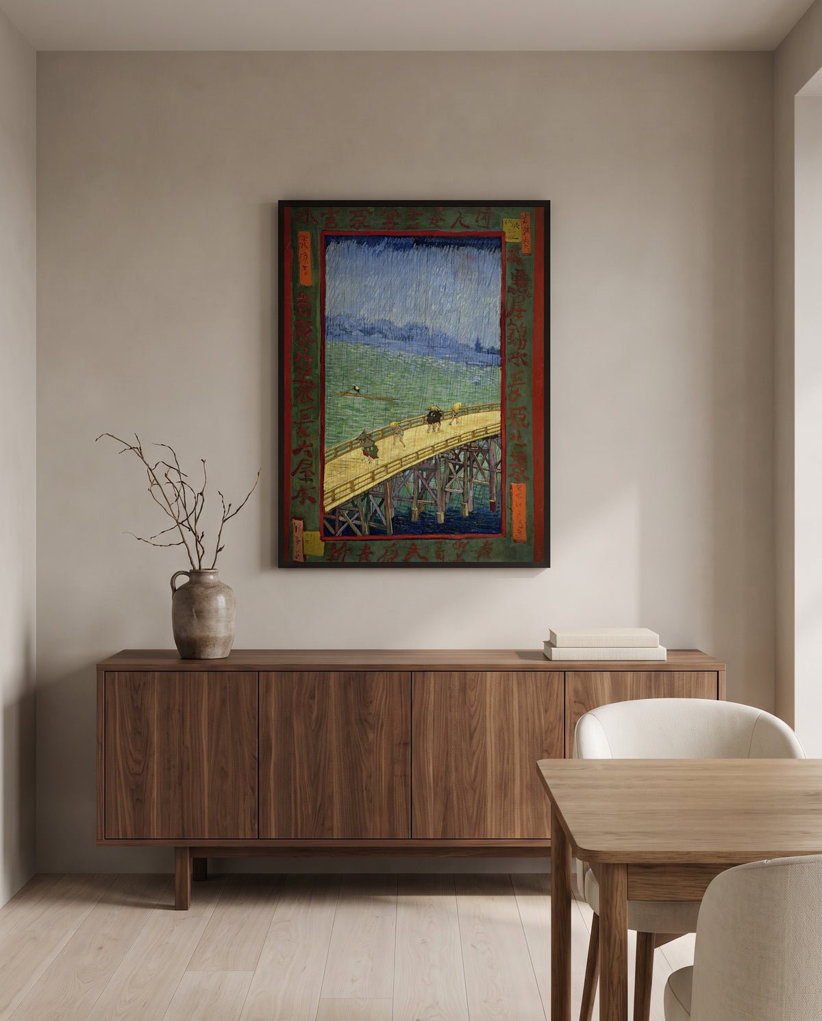 Bridge in the Rain by Vincent van Gogh in a black frame above a walnut sideboard in a dining room