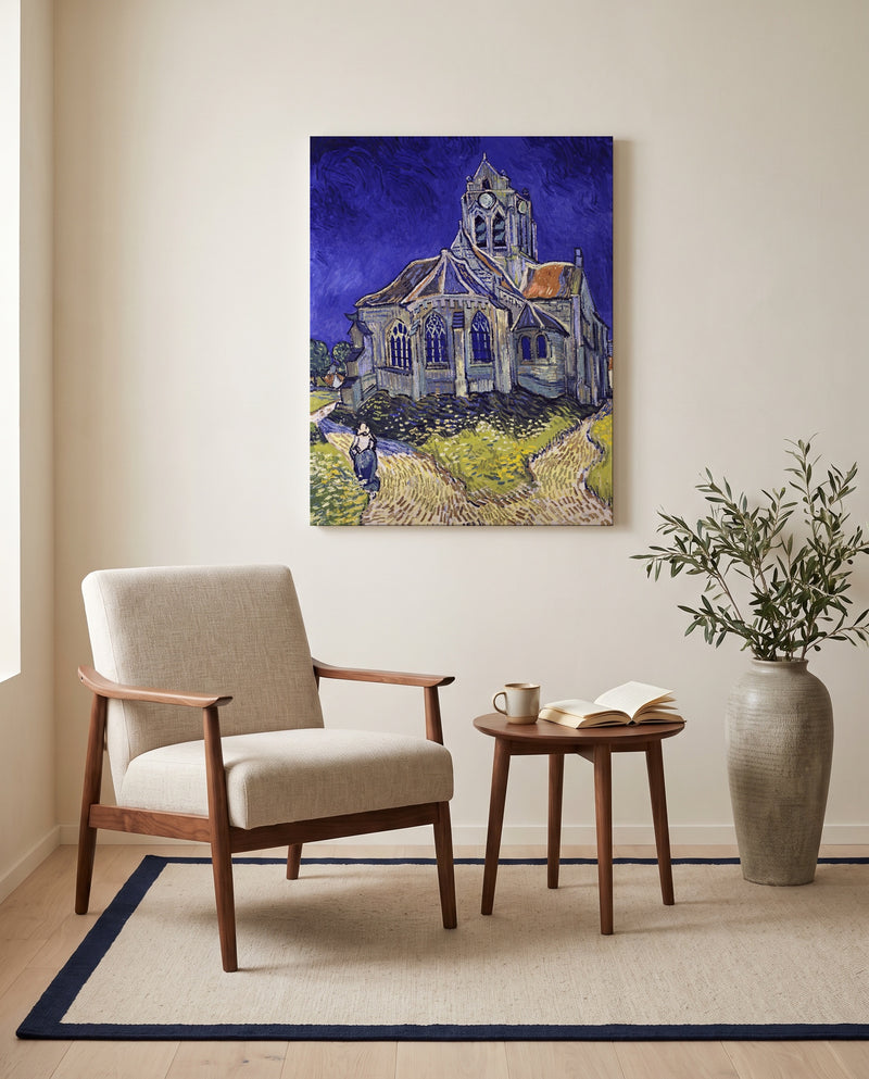 The Church at Auvers by Vincent van Gogh as a stretched canvas above a linen lounge chair in a reading corner