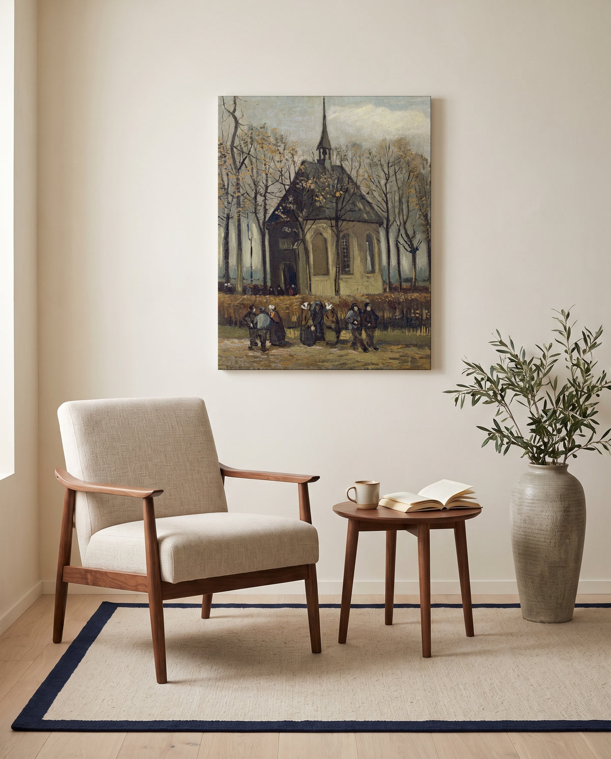 Congregation Leaving the Church by Vincent van Gogh as a stretched canvas above a linen lounge chair in a reading corner