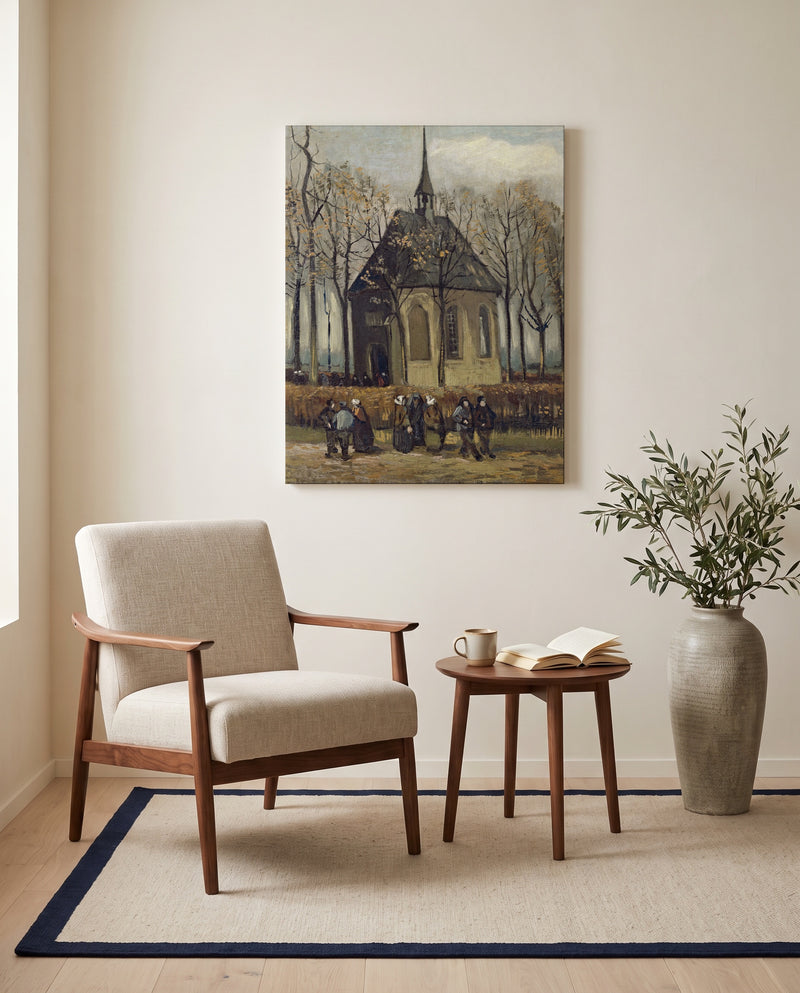 Congregation Leaving the Church by Vincent van Gogh as a stretched canvas above a linen lounge chair in a reading corner