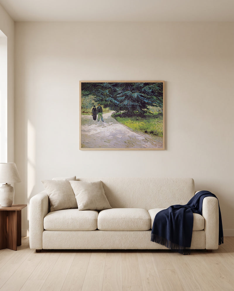 Couple in the Park, Arles by Vincent van Gogh framed in natural oak above a cream sofa in a warm living room