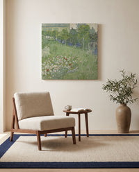 Daubigny’s Garden by Vincent van Gogh as a stretched canvas above a linen lounge chair in a reading corner