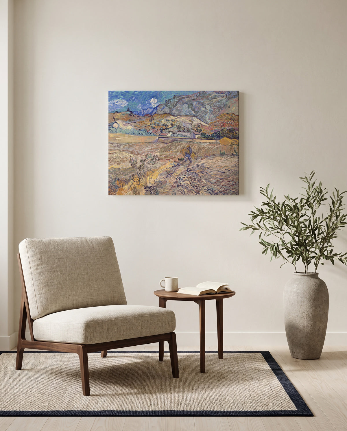 Enclosed Field with Peasant by Vincent van Gogh as a stretched canvas above a linen lounge chair in a reading corner
