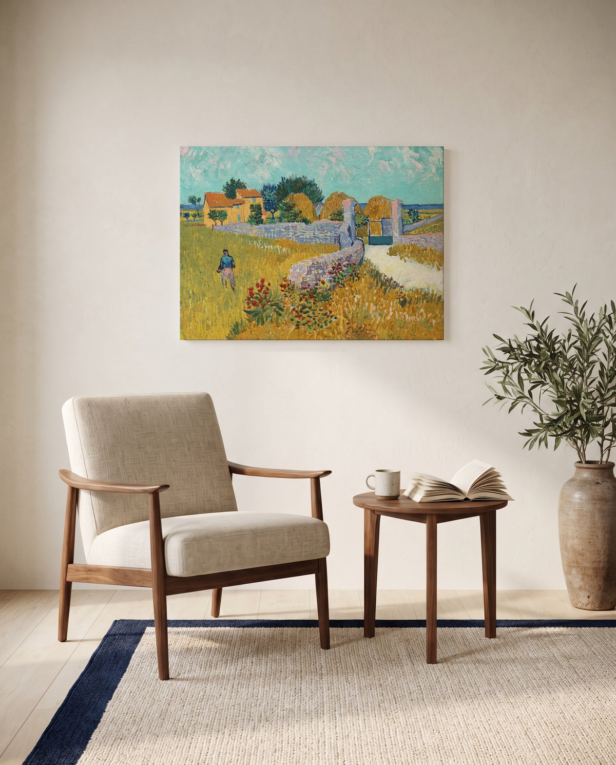 Farmhouse in Provence by Vincent van Gogh as a stretched canvas above a linen lounge chair in a reading corner