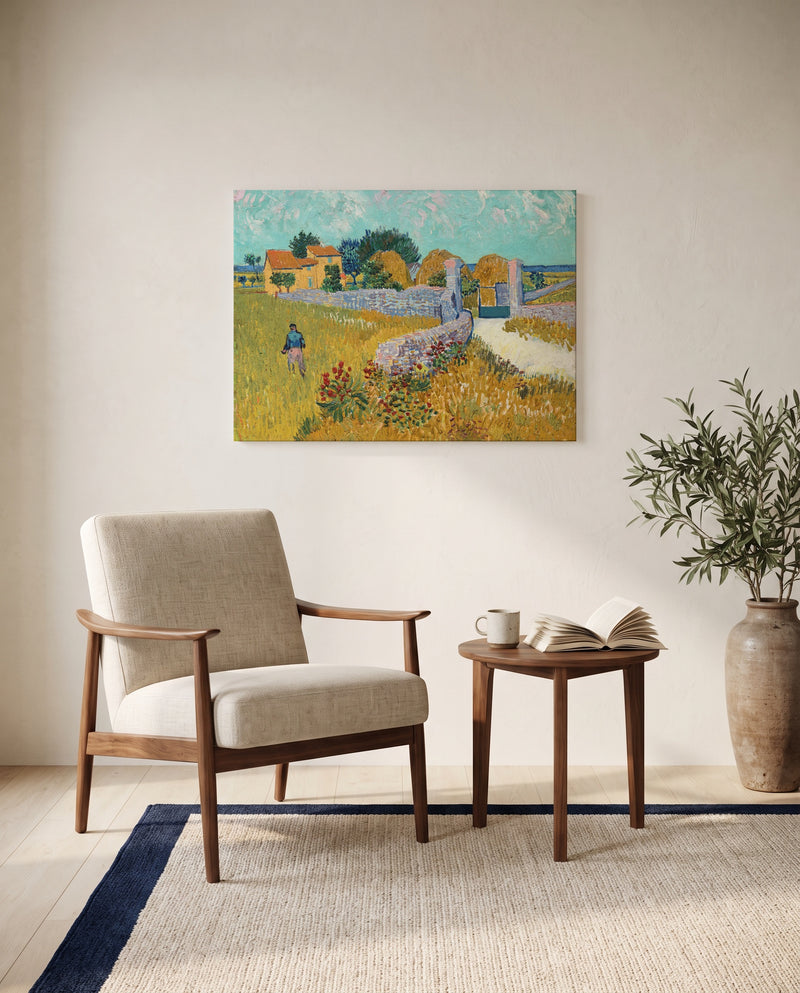 Farmhouse in Provence by Vincent van Gogh as a stretched canvas above a linen lounge chair in a reading corner