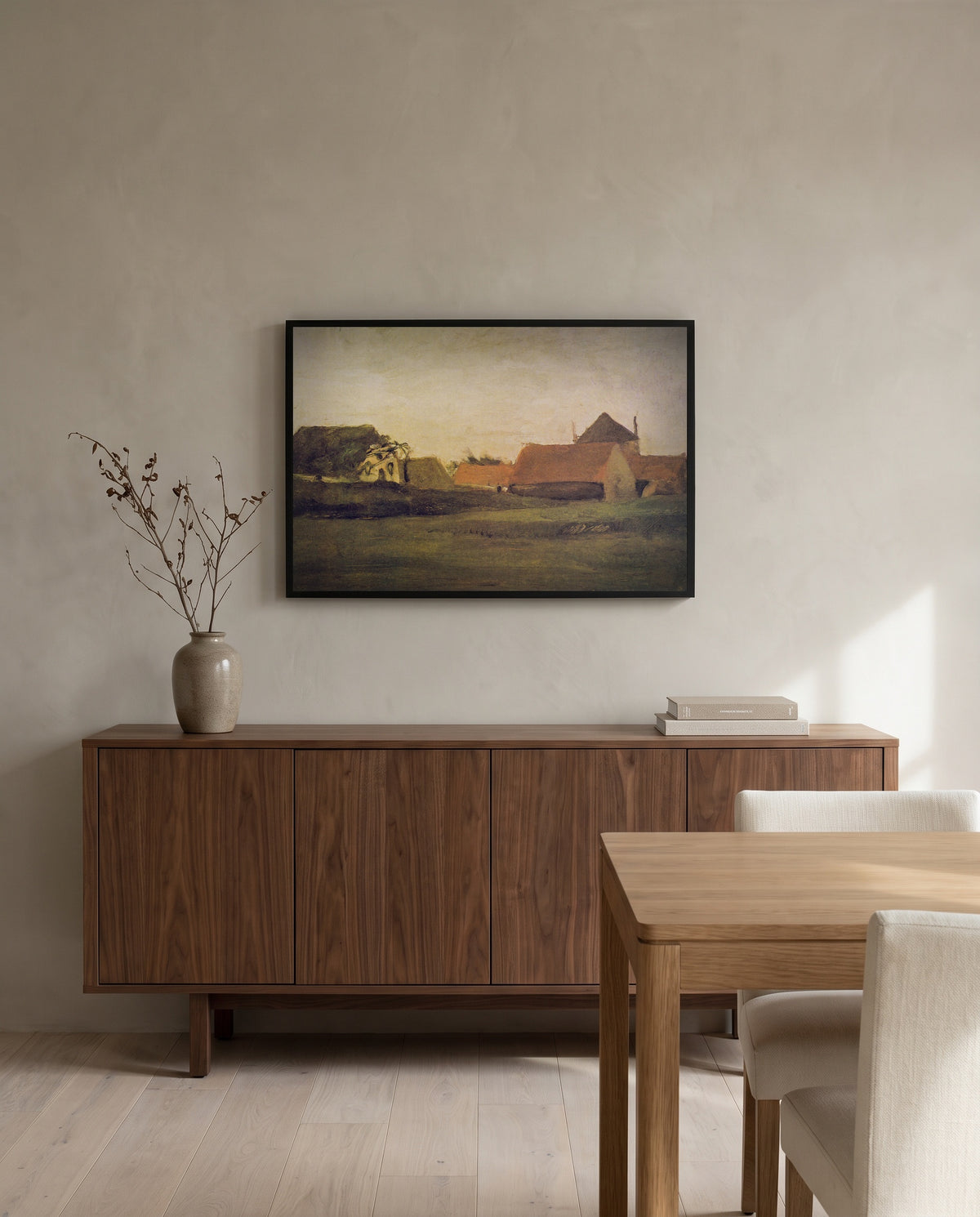 Farmhouses in Loosduinen by Vincent van Gogh in a black frame above a walnut sideboard in a dining room