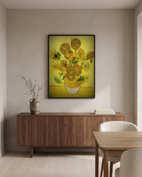 Fifteen Sunflowers by Vincent van Gogh in a black frame above a walnut sideboard in a dining room