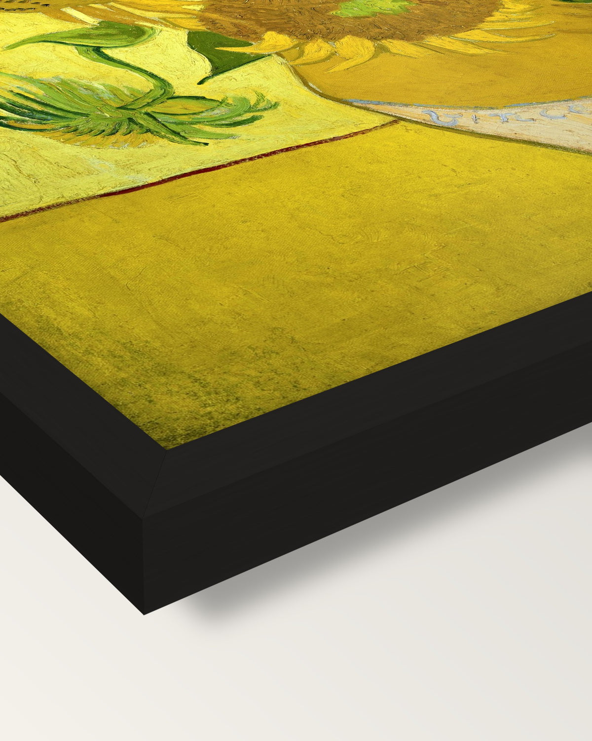 Fifteen Sunflowers by van Gogh framed print, corner close-up: black moulding, mitred, the print set just below its edge