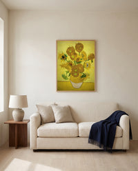 Fifteen Sunflowers by Vincent van Gogh framed in natural oak above a cream sofa in a warm living room