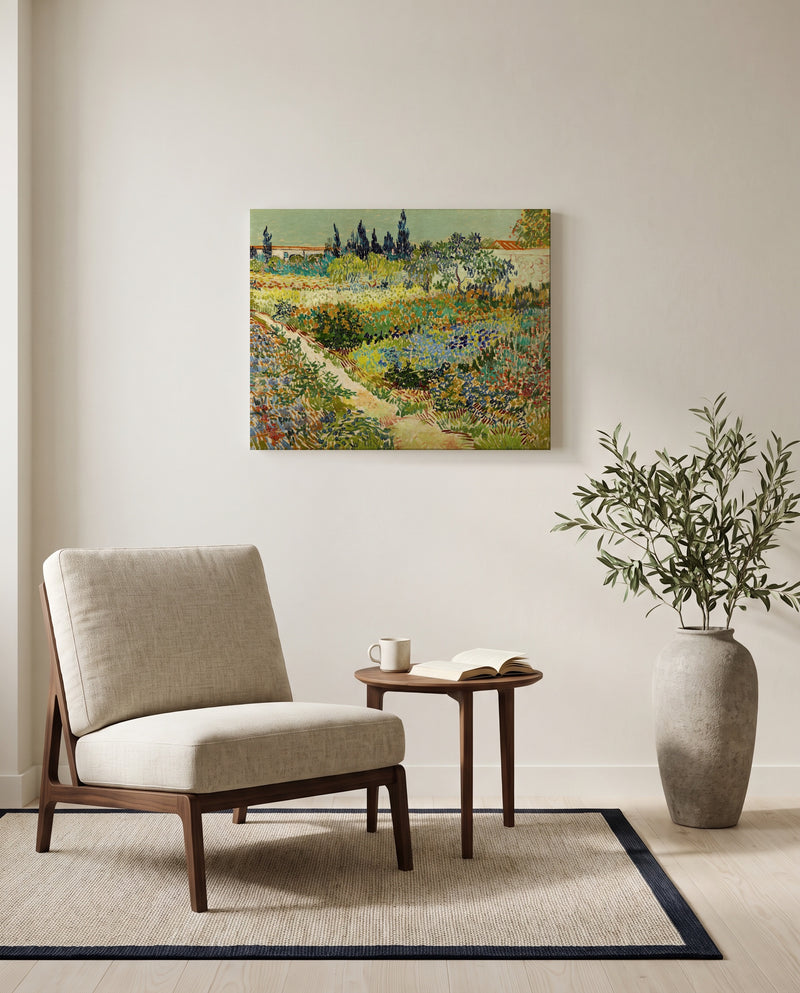 Flowering Garden with Path by Vincent van Gogh as a stretched canvas above a linen lounge chair in a reading corner