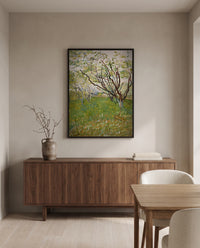 The Flowering Orchard by Vincent van Gogh in a black frame above a walnut sideboard in a dining room