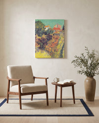 Garden Behind a House by Vincent van Gogh as a stretched canvas above a linen lounge chair in a reading corner