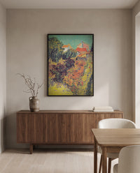 Garden Behind a House by Vincent van Gogh in a black frame above a walnut sideboard in a dining room