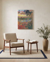 Flowering Garden by Vincent van Gogh as a stretched canvas above a linen lounge chair in a reading corner
