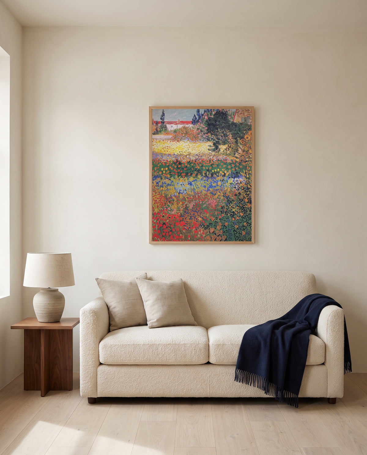 Flowering Garden by Vincent van Gogh framed in natural oak above a cream sofa in a warm living room
