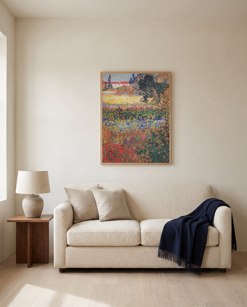 Flowering Garden by Vincent van Gogh framed in natural oak above a cream sofa in a warm living room