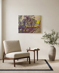 Garden of Saint Paul’s Hospital by Vincent van Gogh as a stretched canvas above a linen lounge chair in a reading corner