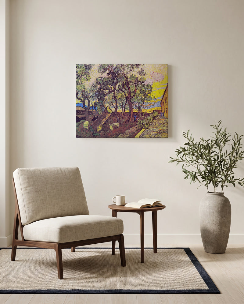 Garden of Saint Paul’s Hospital by Vincent van Gogh as a stretched canvas above a linen lounge chair in a reading corner